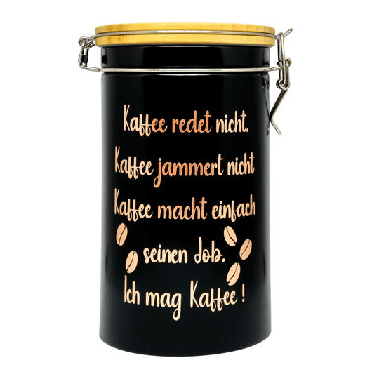 Schwarze Kaffeedose mit Bambusdeckel und Bügelverschluss auf weißem Hintergrund. Spruch in rosegold: Kaffee redet nicht. 